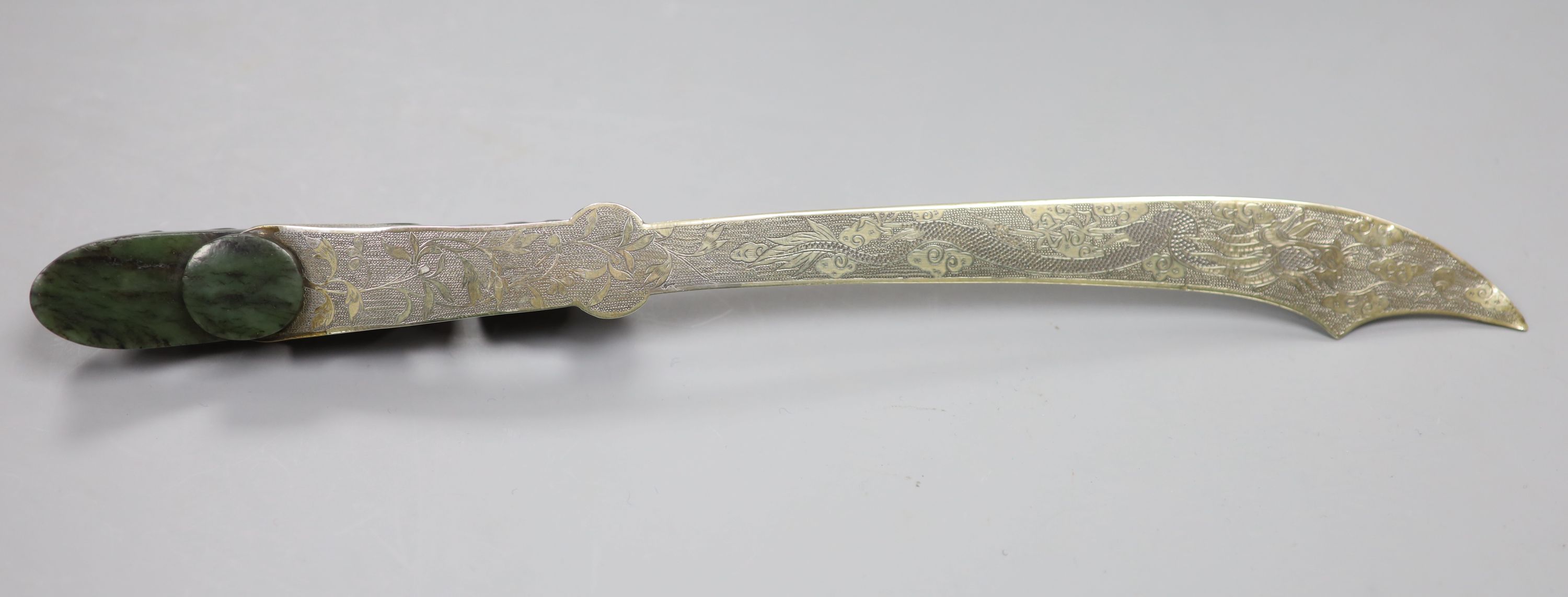 An 18th/19th century Chinese spinach green jadeite dragon belt hook, mounted as the handle for a paperknife, length 32cm